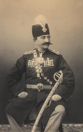 A studio portrait photograph of Nasr al-din Shah Qajar (reg. 1848-96) (frame cropped) — W. &amp; D. Downey
